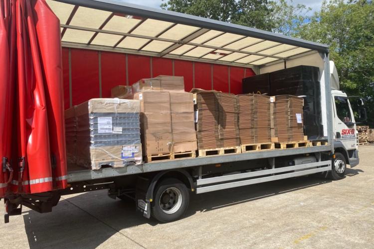 One of our lorries with its side curtain open and loaded up with pallets