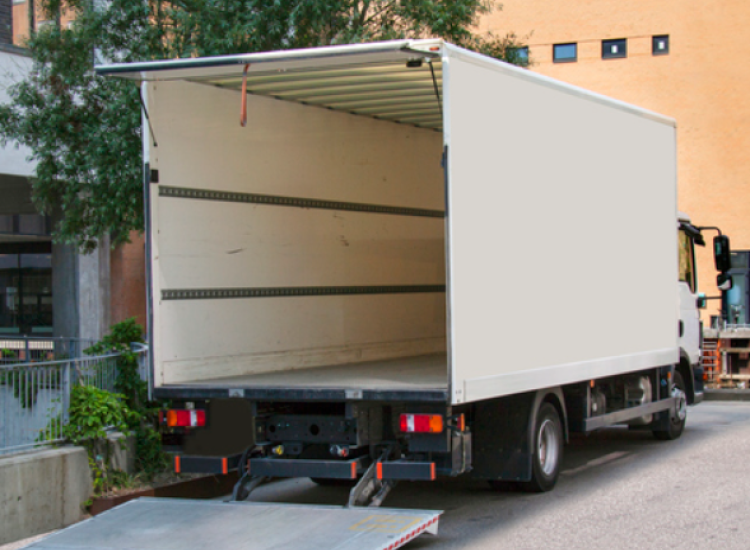 One of our white Tail Lift Lorries with its tail lift down